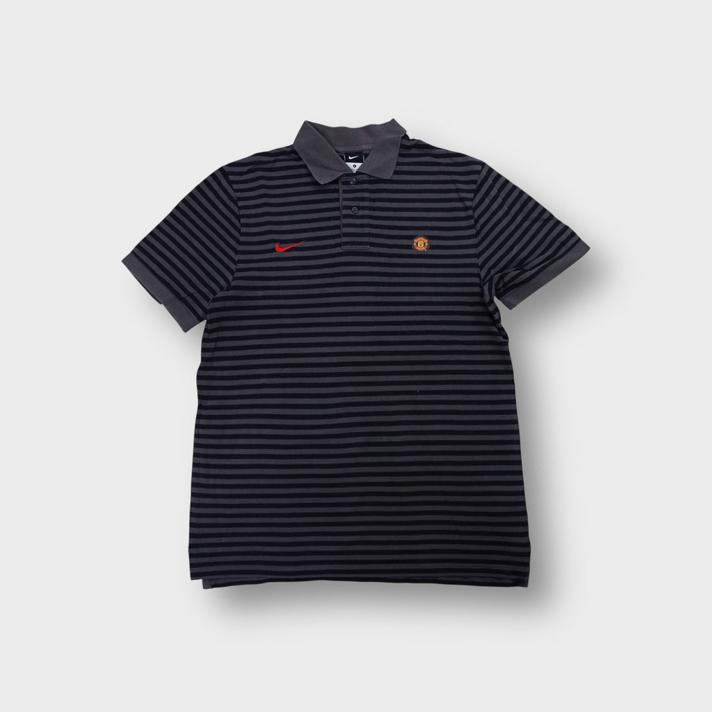 Nike Manchester United polo shirt in black and grey stripes with red swoosh logo