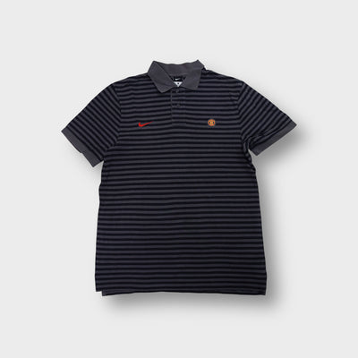 Nike Manchester United polo shirt in black and grey stripes with red swoosh logo