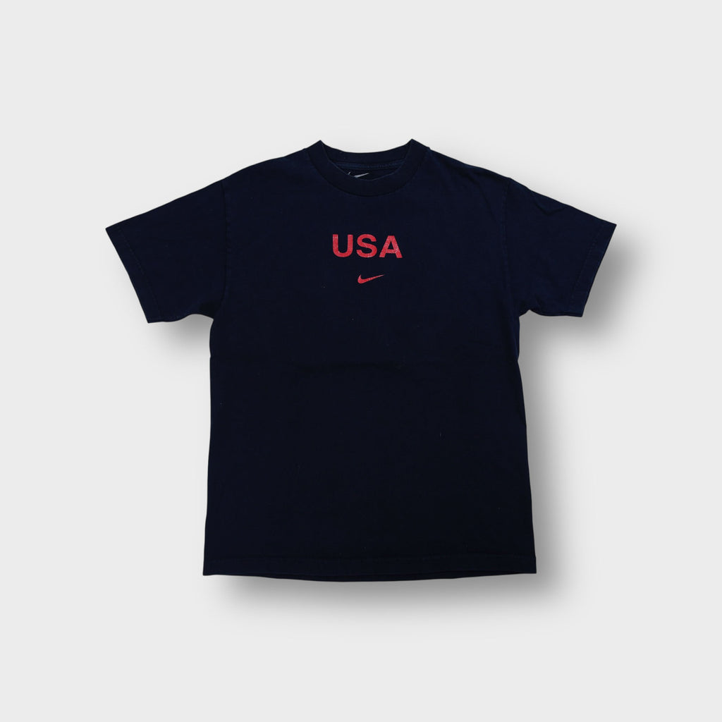 Nike T-Shirt in navy featuring red USA graphic print and swoosh logo