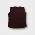Nike vest in brown featuring a small embroidered yellow swoosh logo on the chest