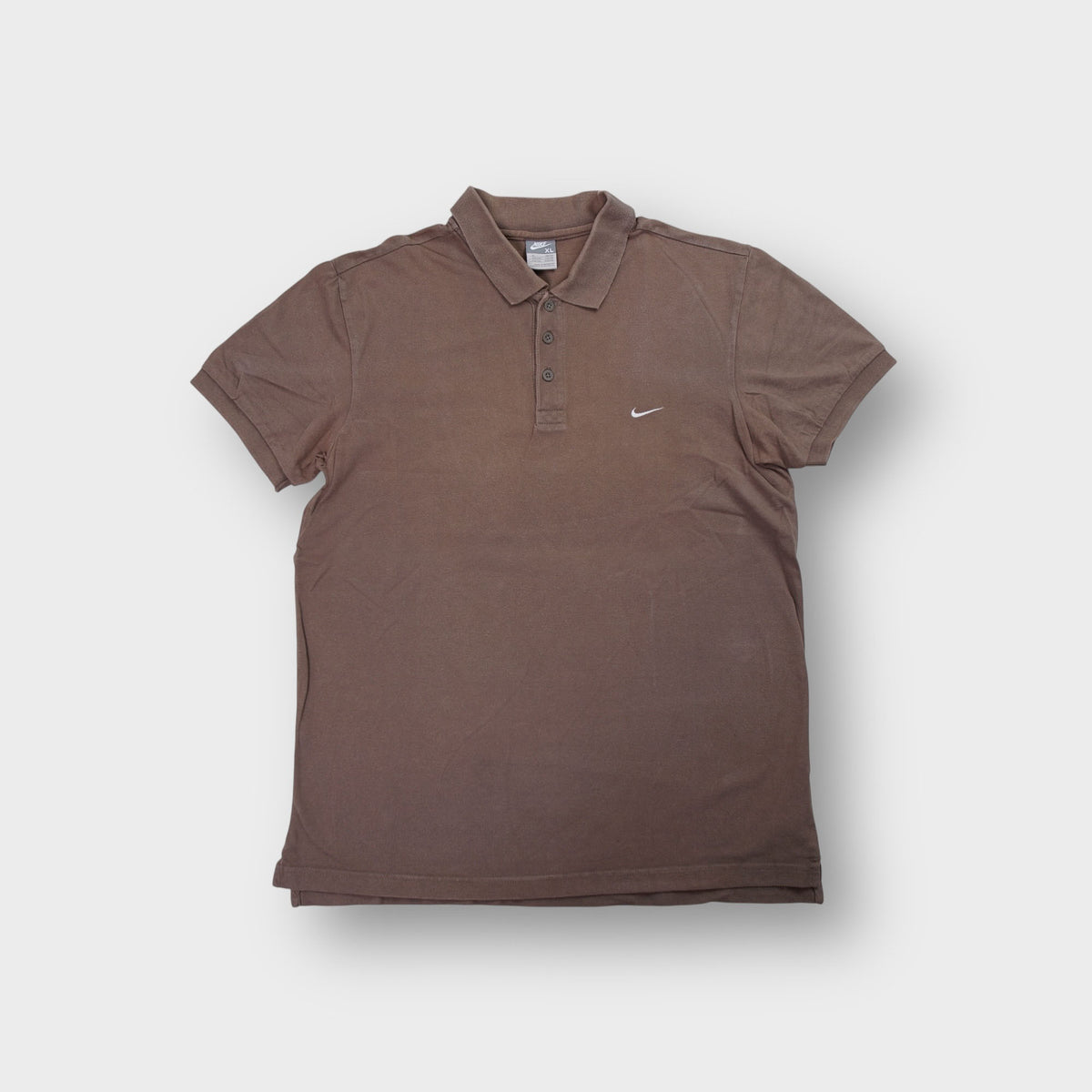 Nike brown short sleeve polo shirt with small white embroidered swoosh logo