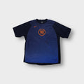 Nike football jersey in navy with an orange Total 90 logo on the front