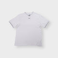 White Nike T-Shirt with centered swoosh embroidery and navy tipped V-neck collar