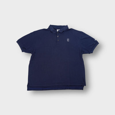 Nike polo shirt in navy featuring an embroidered white tennis court logo
