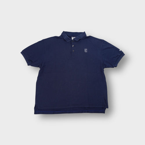Nike polo shirt in navy featuring an embroidered white tennis court logo