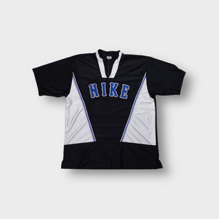 Nike warm up jersey in black and white with blue embroidered chest lettering