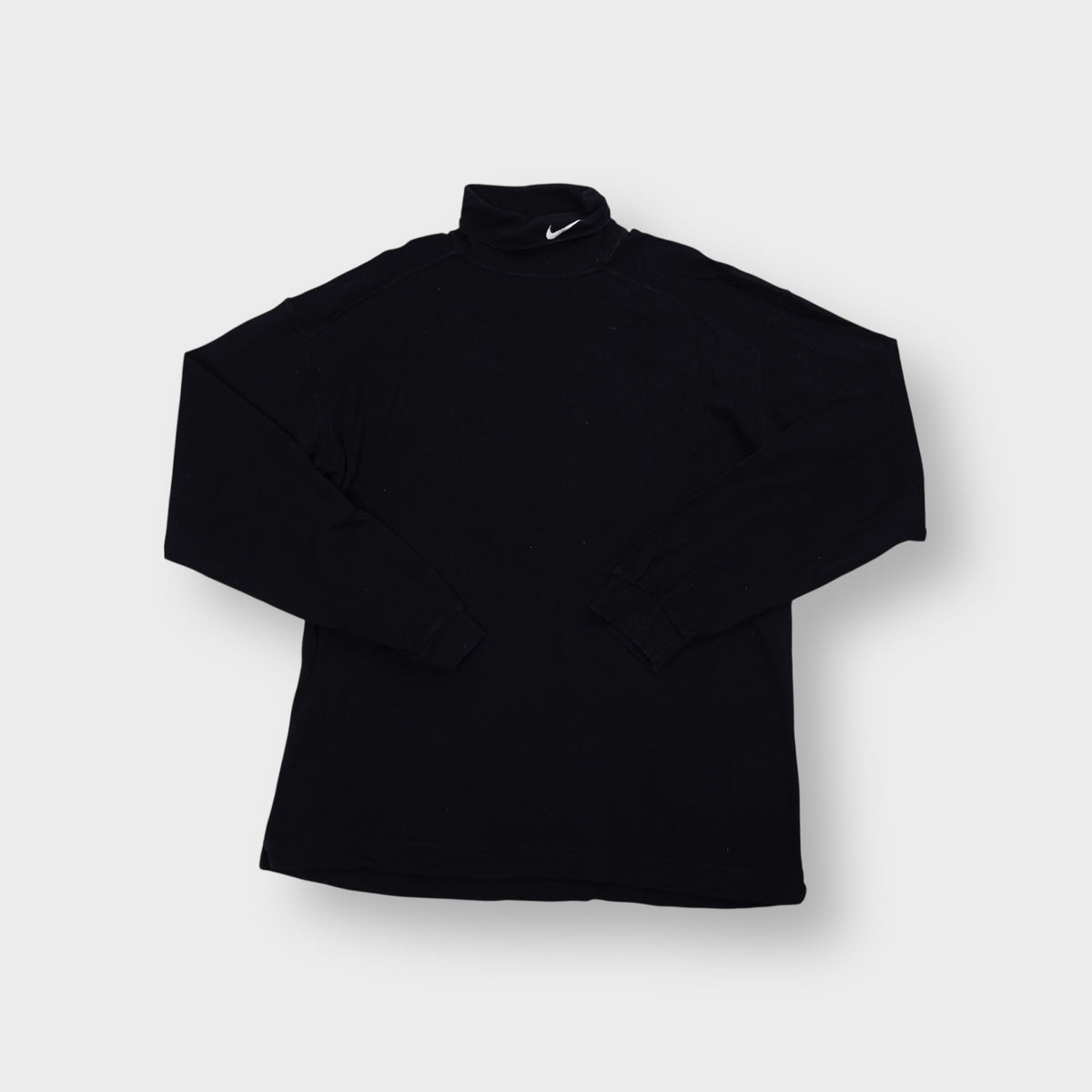 Nike turtleneck sweater in black with embroidered white Swoosh logo on collar