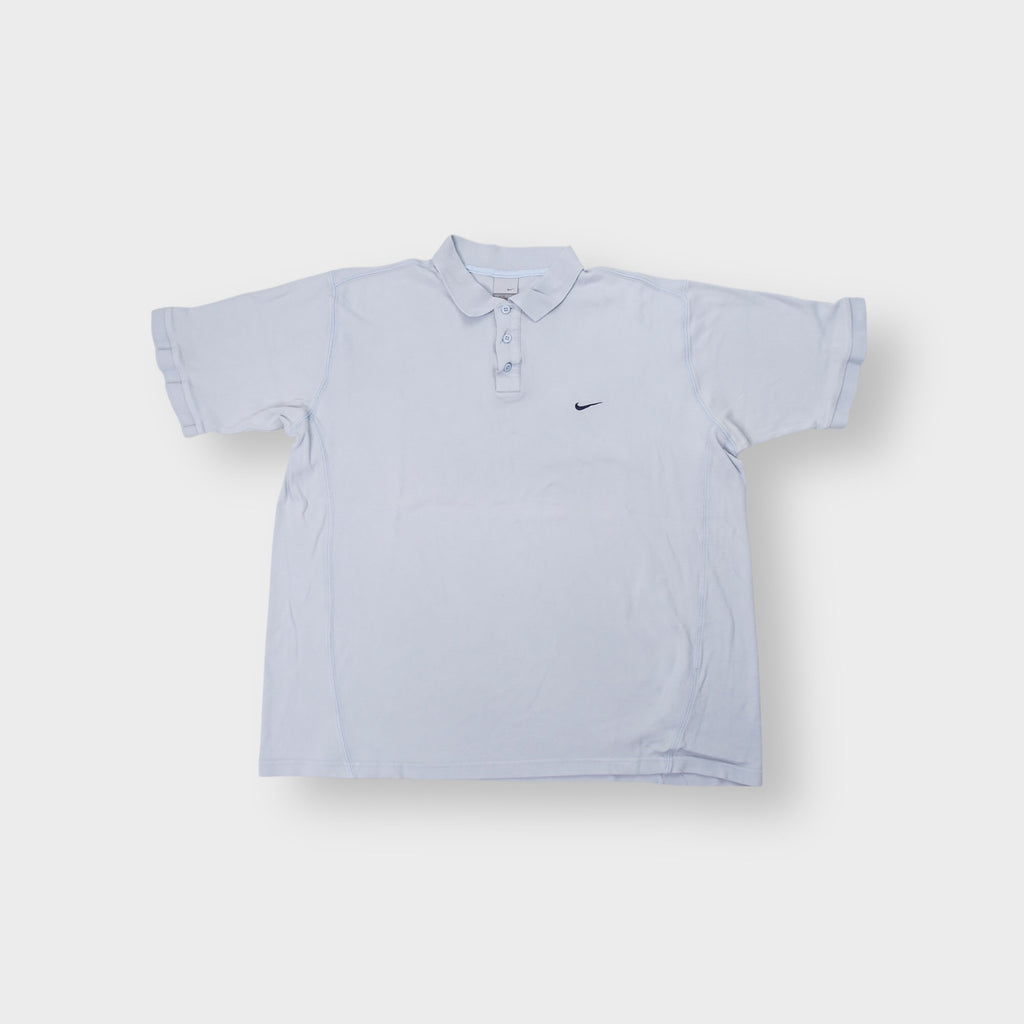 Light blue Nike polo shirt featuring a dark embroidered swoosh on the left chest