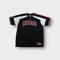 Black Nike Chicago Bulls shooting shirt with red embroidered chest lettering.