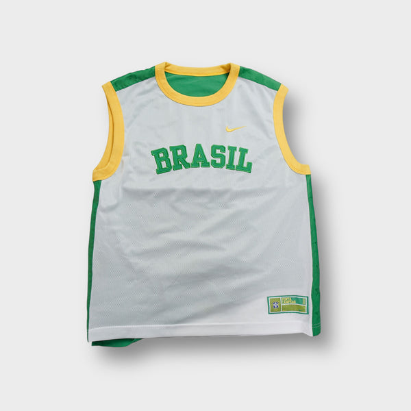 Nike Brazil jersey in green, yellow, and white with printed Brasil text and yellow Swoosh.