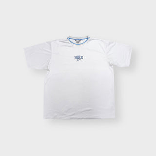 Nike T-Shirt in white featuring blue embroidered central text and swoosh chest logo.
