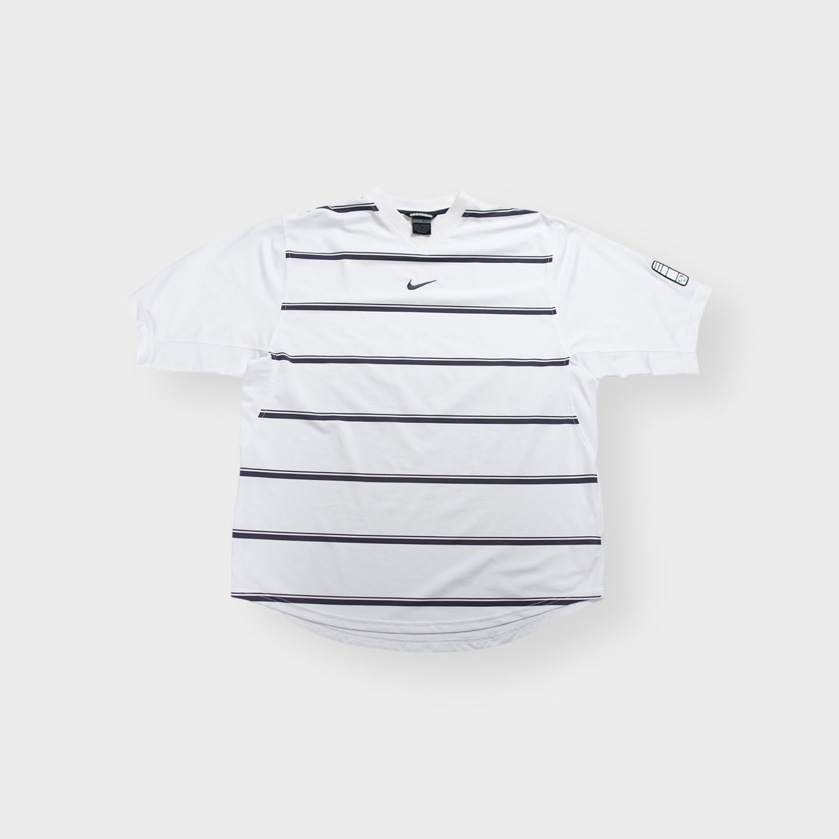 Nike jersey shirt in white and navy featuring horizontal stripes and chest Swoosh logo