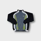 Adidas track jacket in grey and black with yellow three-stripe chest embroidery.