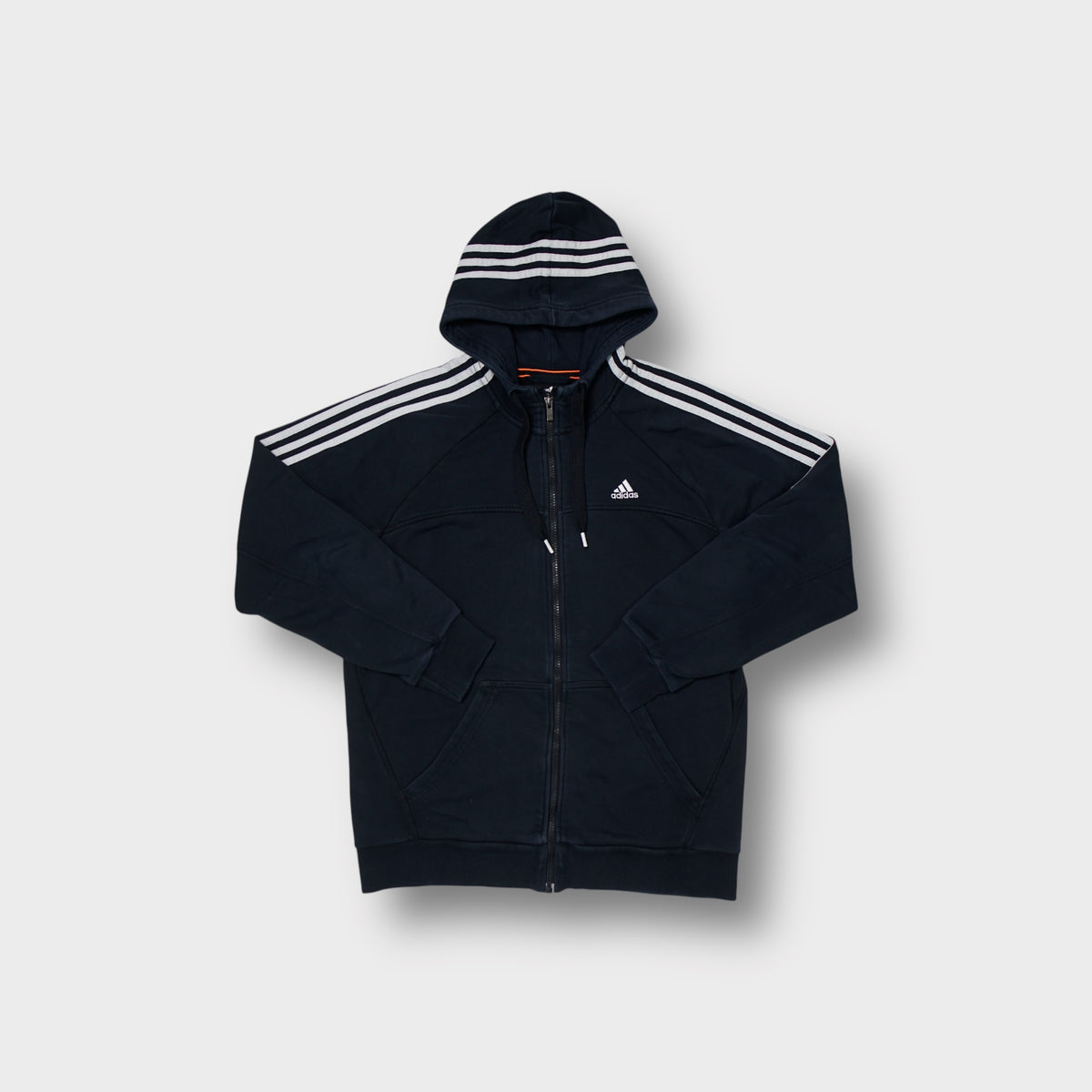 Adidas full-zip hoodie in navy blue with white three stripes across the hood