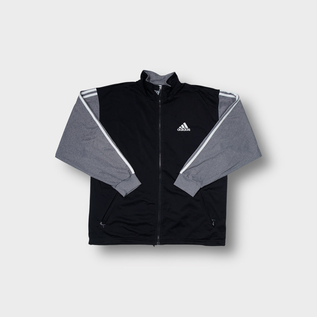 Adidas track jacket in black and grey with small embroidered chest logo and zip front