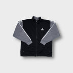 Adidas track jacket in black and grey with small embroidered chest logo and zip front