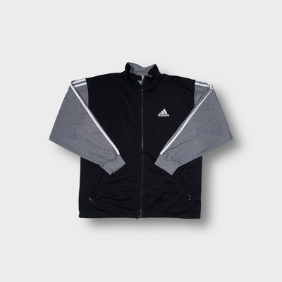 Adidas track jacket in black and grey with small embroidered chest logo and zip front