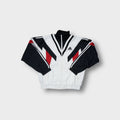 Adidas track jacket in white, black, and red with geometric panelling