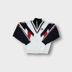 Adidas track jacket in white, black, and red with geometric panelling