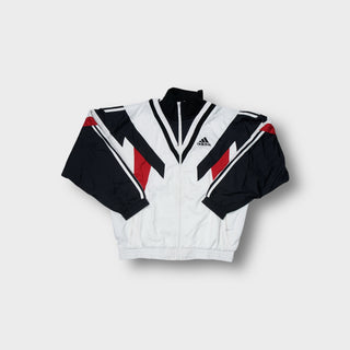 Adidas track jacket in white, black, and red with geometric panelling