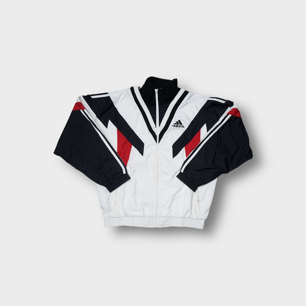 Adidas track jacket in white, black, and red with geometric panelling