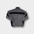 Asics track jacket in gray and black featuring white piping and chest logo patch