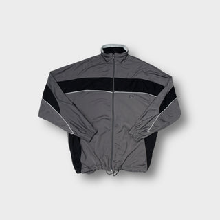 Asics track jacket in gray and black featuring white piping and chest logo patch