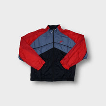 Load image into Gallery viewer, Nike track jacket in red, blue, and black with a chevron pattern and embroidered logo