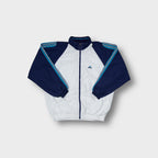 Adidas track jacket in white and navy with blue stripe details on the sleeves.