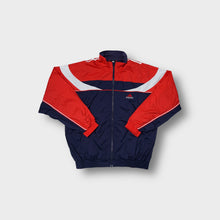 Load image into Gallery viewer, Adidas track jacket in navy, red, and white featuring geometric paneling and white piping.