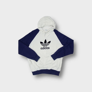 Adidas 90s hoodie in white and navy featuring a large printed trefoil front logo.
