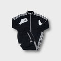 Adidas tracksuit set in black and white featuring contrast panel details