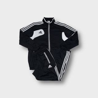 Adidas tracksuit set in black and white featuring contrast panel details