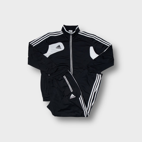 Adidas tracksuit set in black and white featuring contrast panel details