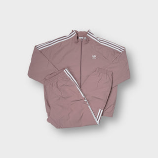 Adidas tracksuit in mauve with white three-stripe detailing and trefoil logo