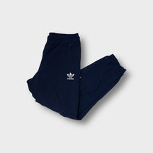 Lade das Bild in den Galerie-Viewer, Adidas navy vintage trackpants featuring a white embroidered trefoil logo on the upper leg.