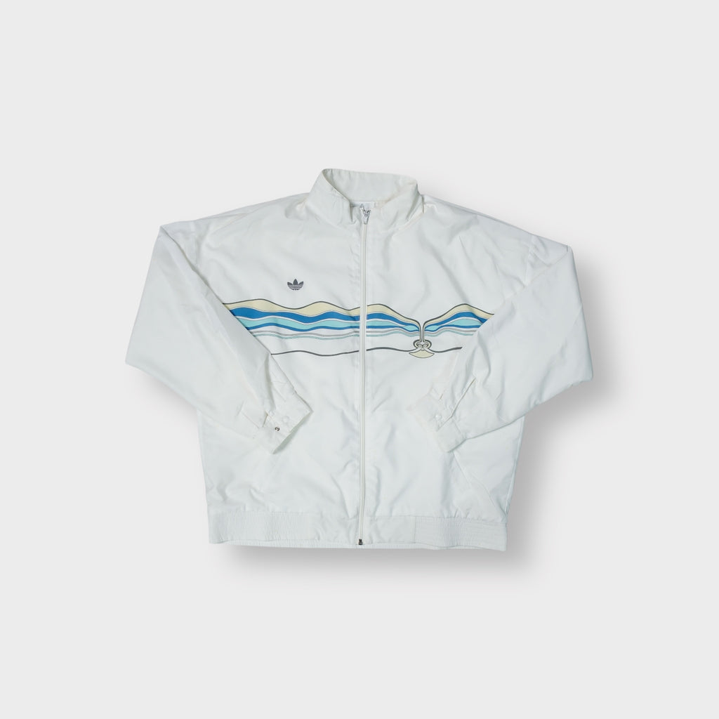 Adidas white track jacket with a blue and yellow wavy graphic print across chest