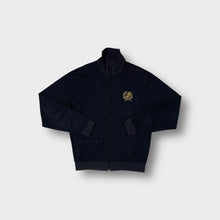 Load image into Gallery viewer, Adidas track jacket in navy featuring a gold embroidered tennis laurel crest