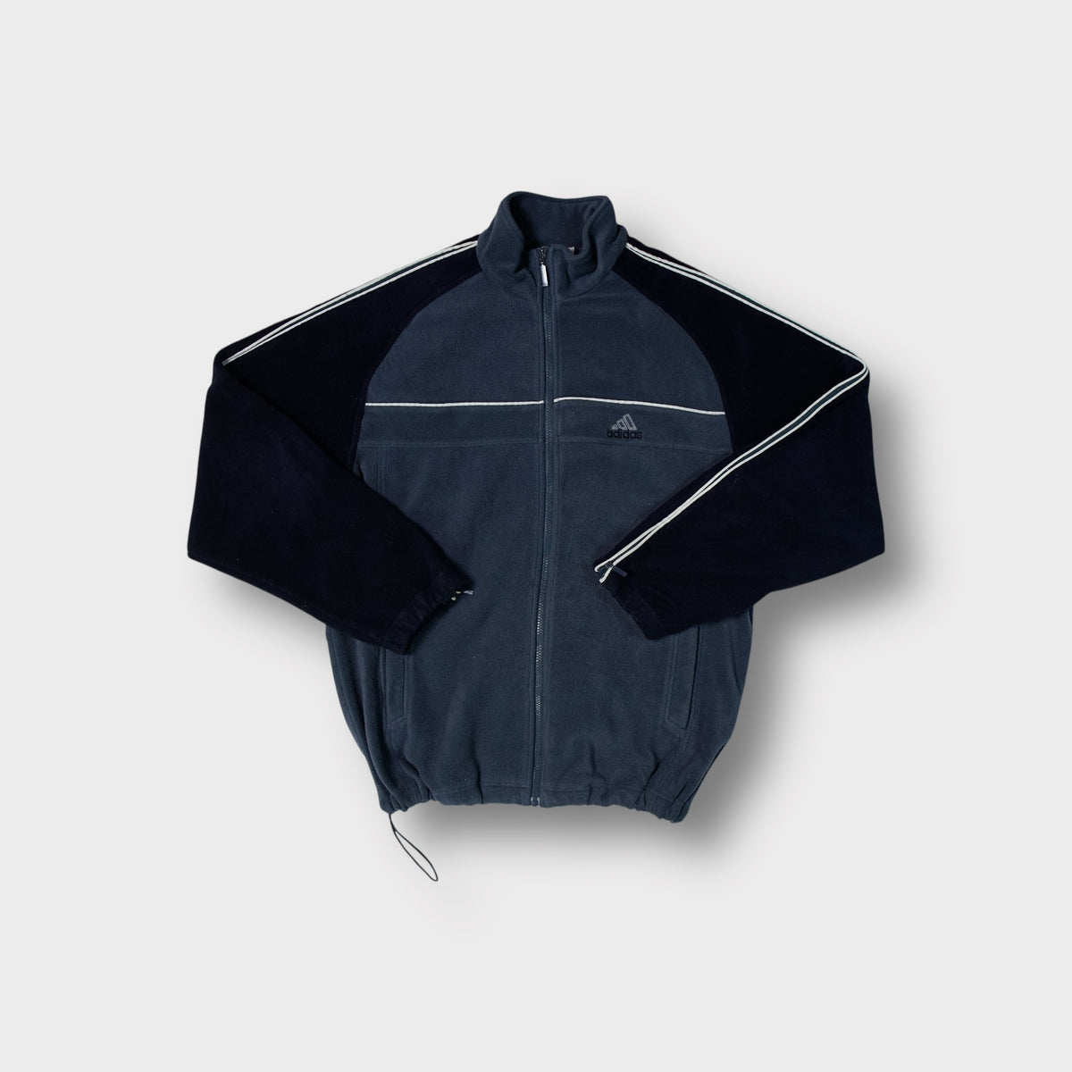 Adidas fleece jacket in navy and black featuring white sleeve stripes