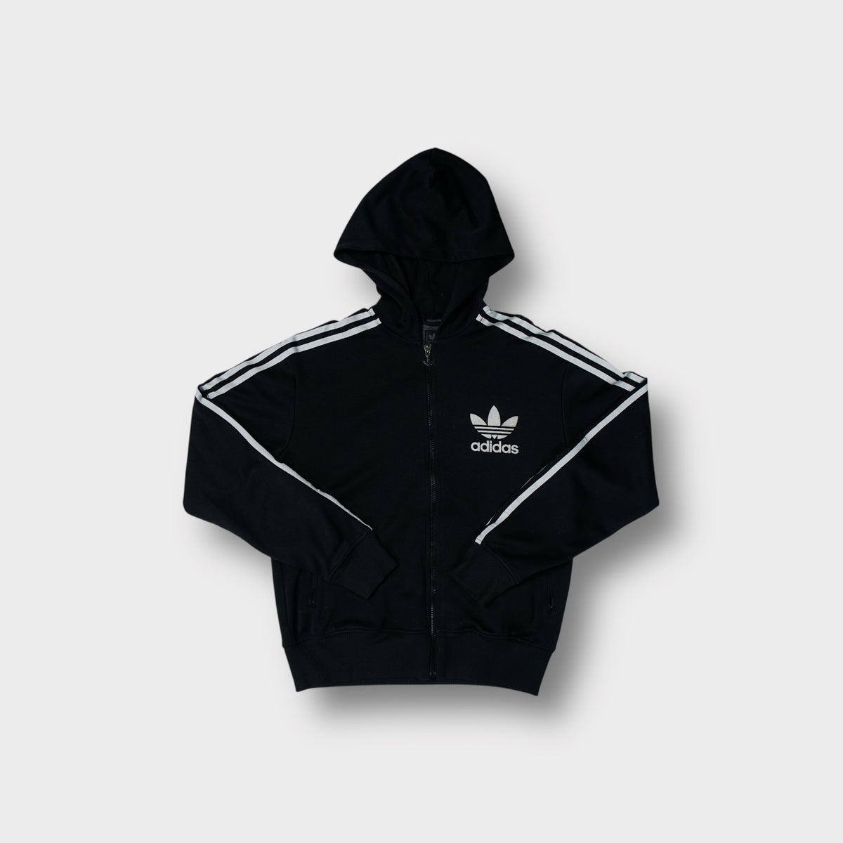Adidas Originals zip-up hoodie in black with white trefoil logo and three stripes