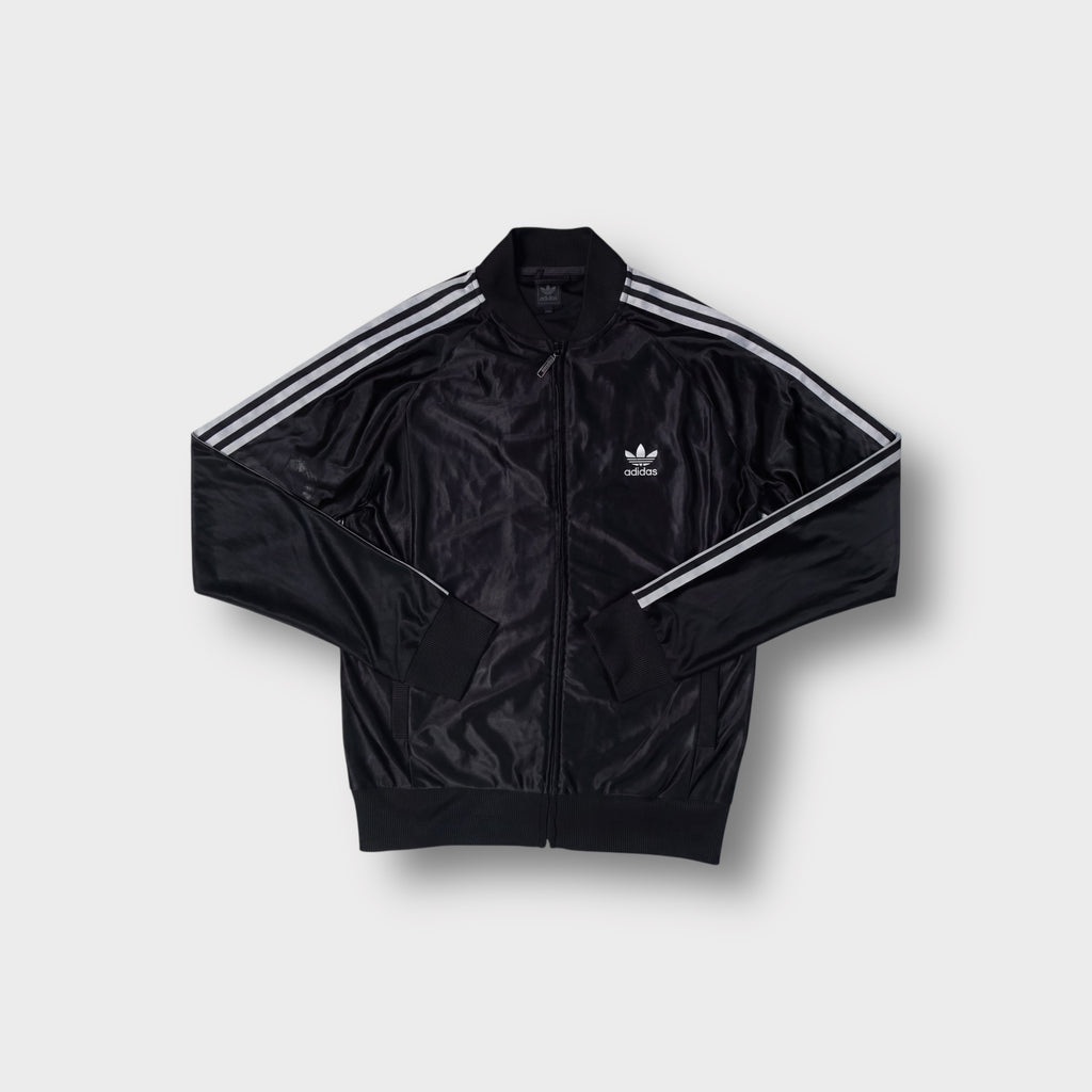Black Adidas track jacket featuring white three stripes on sleeves and trefoil chest logo