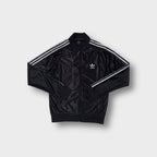 Black Adidas track jacket featuring white three stripes on sleeves and trefoil chest logo