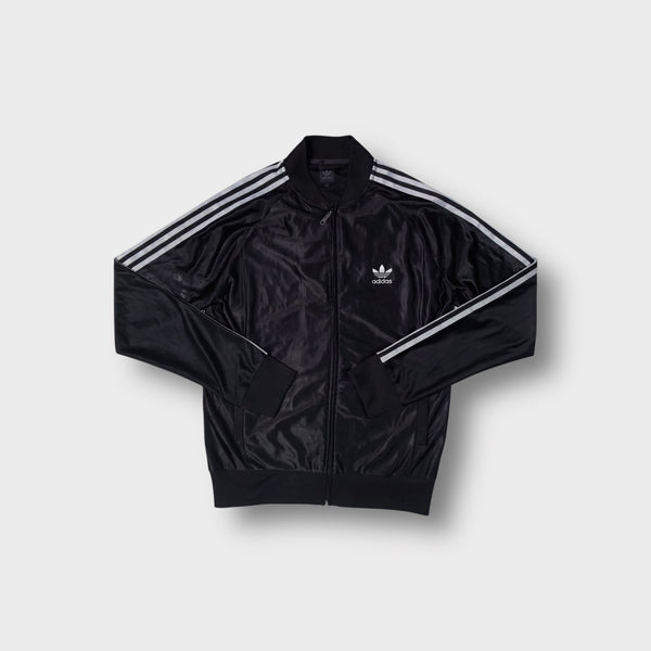 Black Adidas track jacket featuring white three stripes on sleeves and trefoil chest logo