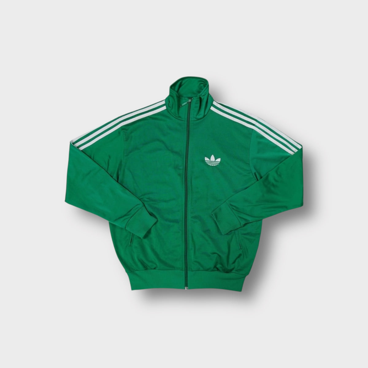 Adidas green track jacket with white three-stripes on sleeves and trefoil chest logo