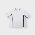 Lacoste Sport white polo shirt with navy blue side piping and embroidered logo