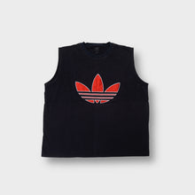 Load image into Gallery viewer, Adidas jacket in black featuring a large red embroidered Trefoil logo on the front chest