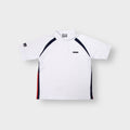 Umbro polo shirt in white with dark navy raglan style stripes and chest badge