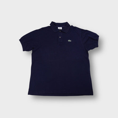 Lacoste navy polo shirt with an embroidered crocodile logo on the chest