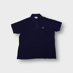 Lacoste polo shirt in navy blue featuring an embroidered green crocodile chest logo