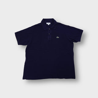 Lacoste polo shirt in navy blue featuring an embroidered green crocodile chest logo